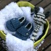 Baby Buckets include Itty Bitty soft and silky baby blankets + spare bitty, crochet organic cotton baby bootie loafers and a crochet mouse baby rattle all contained in a fun and useful fabric basket.